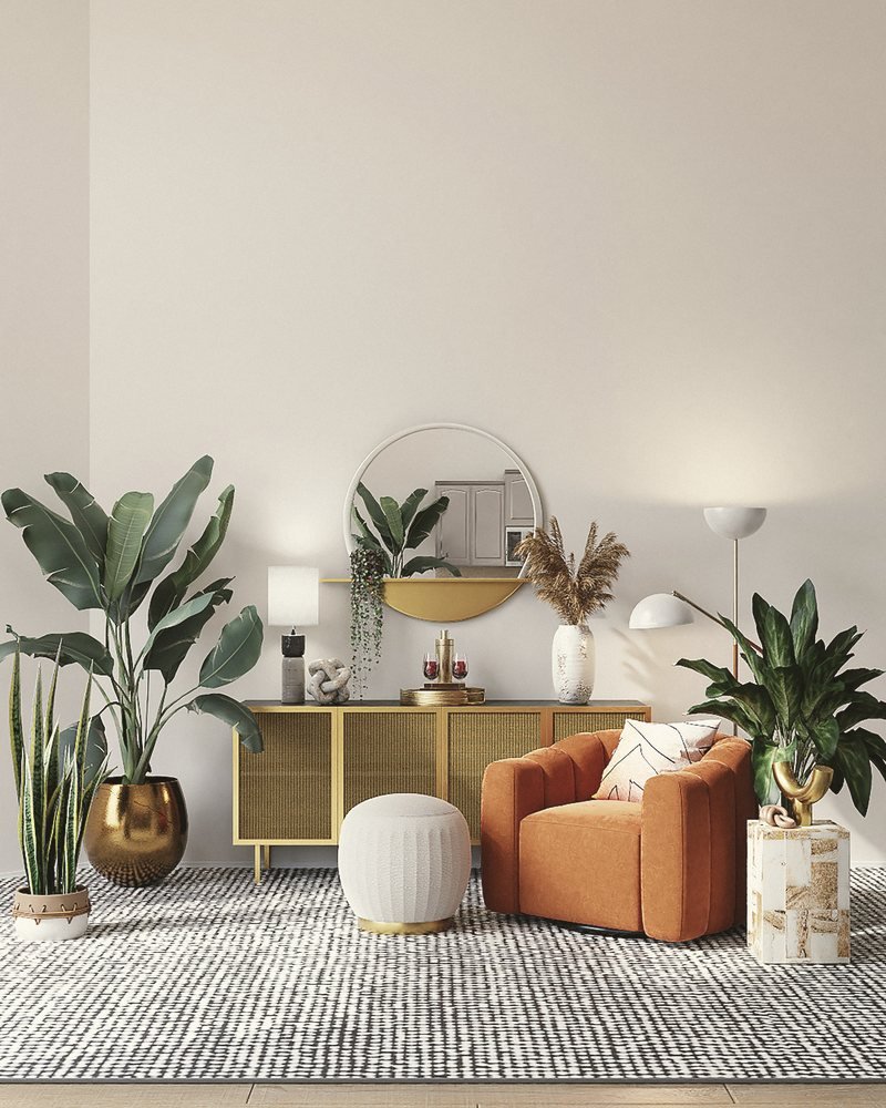 A reading corner with plants and a woven pendant